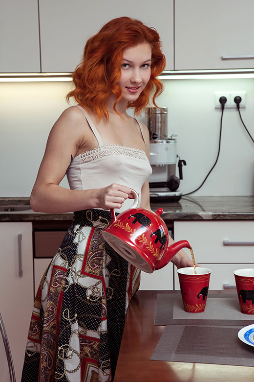 Redhead housewife offers cup of tea