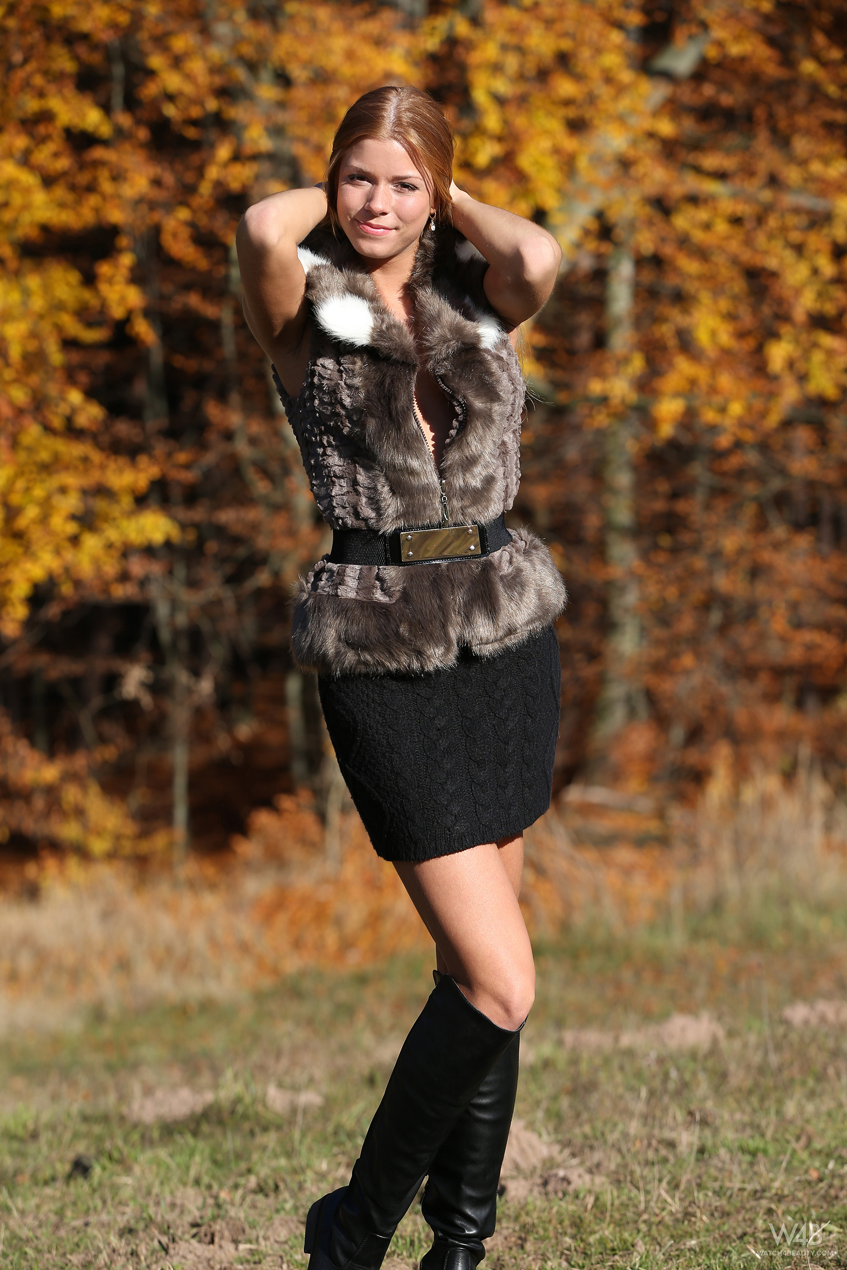 Redhead girl in Autumn scenery